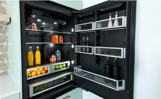 A JennAir Built-In Refrigerator in a modern, bright kitchen. 